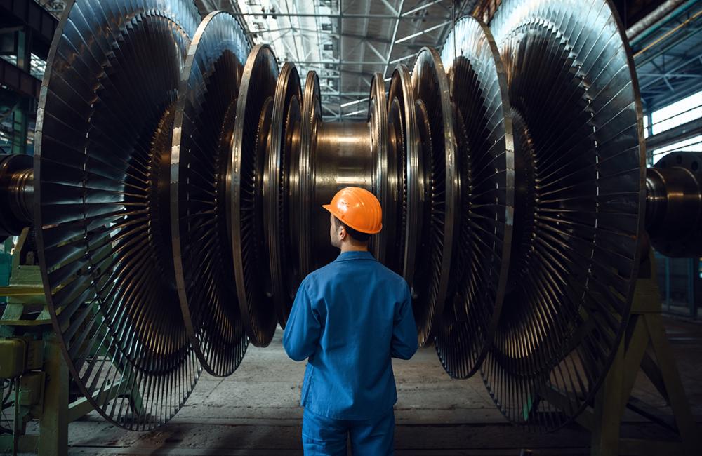 Worker inspects gas turbine