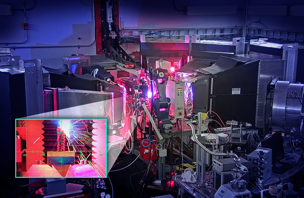 The OpeN-AM experimental platform, installed at the VULCAN instrument at ORNL’s Spallation Neutron Source, features a robotic arm that prints layers of molten metal to create complex shapes. This allows scientists to study 3D printed welds microscopically. Credit: Jill Hemman, ORNL/U.S. Dept. Of Energy