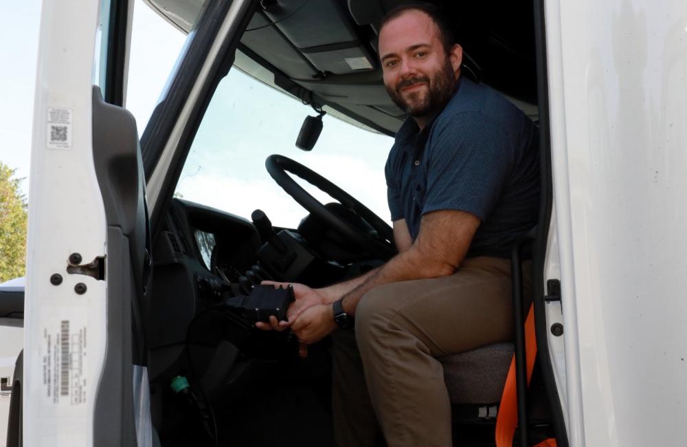 Sam Hollifield displays a prototype of the Secure Hijack, Intrusion and Exploit Layered Detector, or SHIELD, the device monitoring the cybersecurity of the semi-truck. Credit: Lena Shoemaker/ORNL, U.S. Dept. of Energy