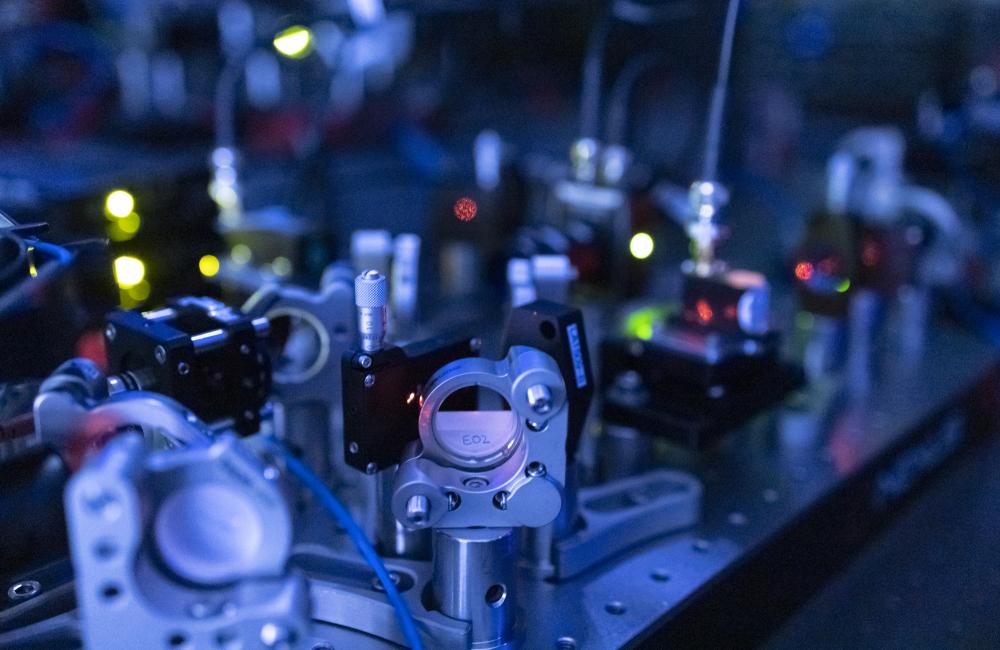 Optical tables and ion trap chamber in a quantum research lab
