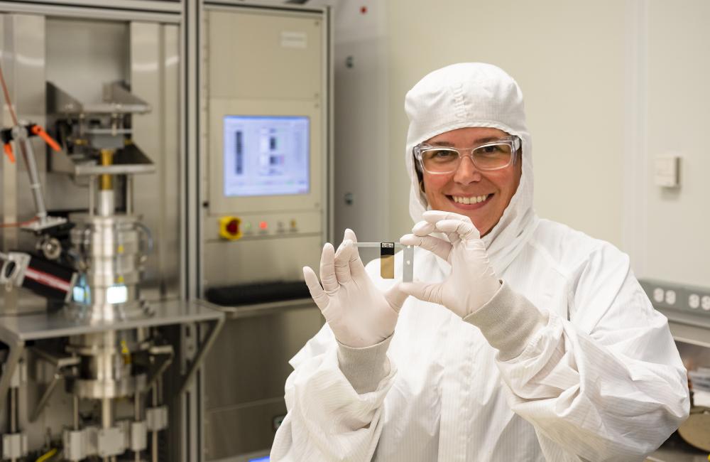 A technician shows off a diamond foil fabricated in the Center for Nanophase Materials Sciences clean room. 