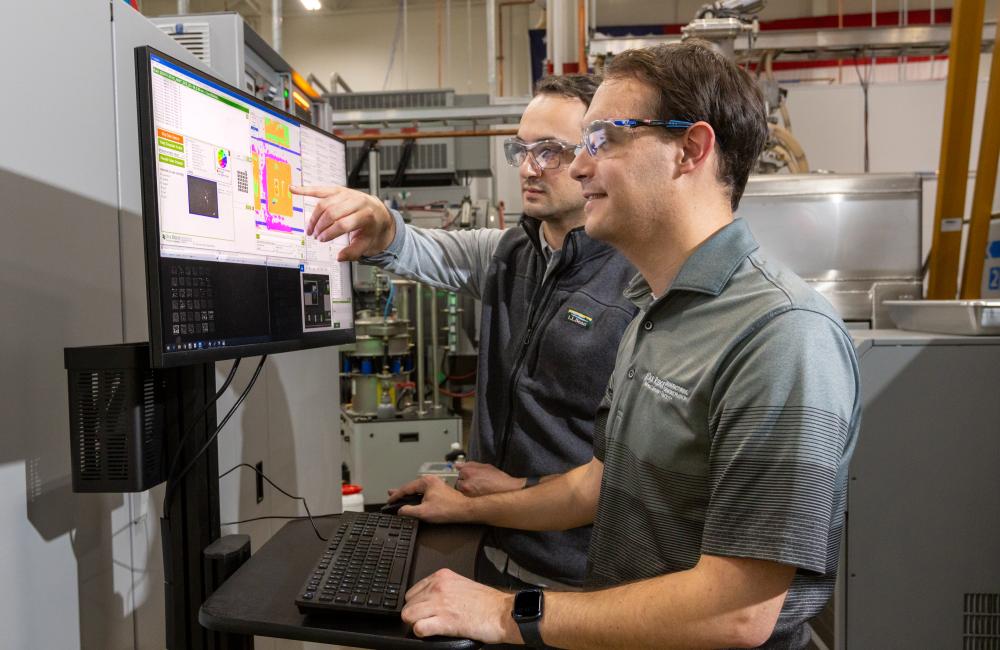 two researchers at a monitor
