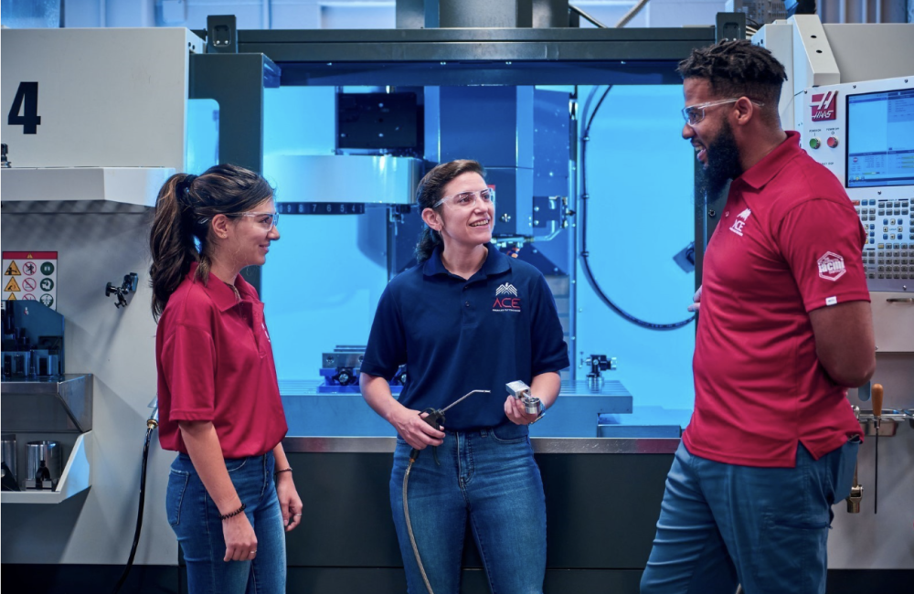 three people talking in a high tech setting