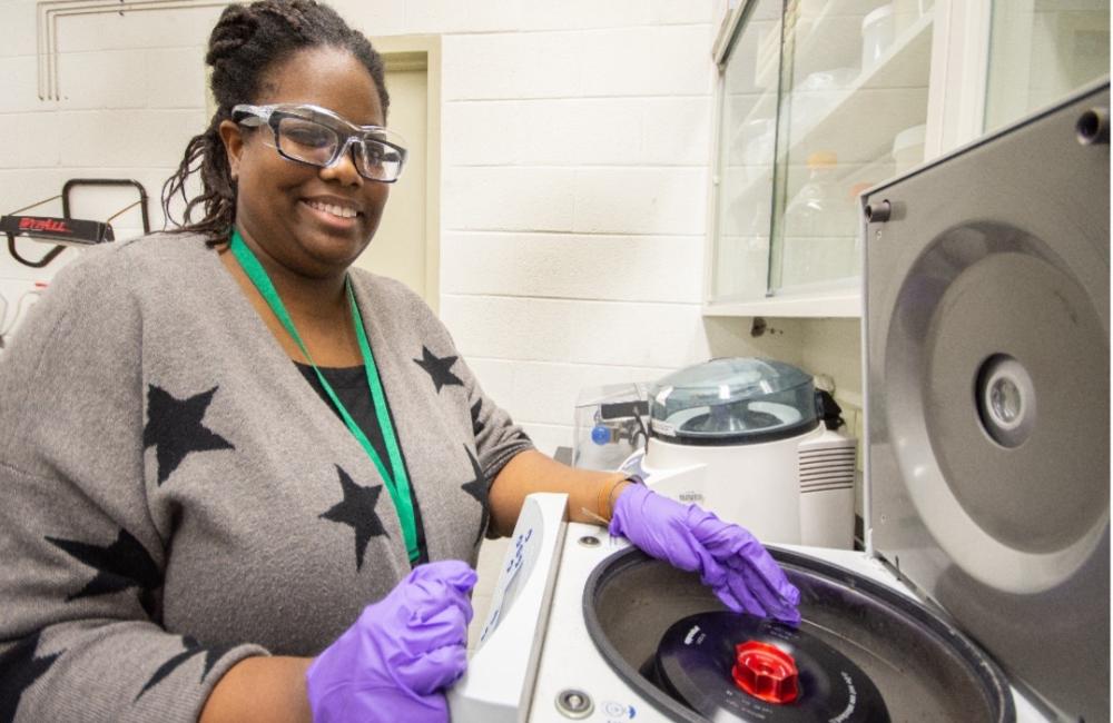 Zuri Phillips standing in front of table top equipment