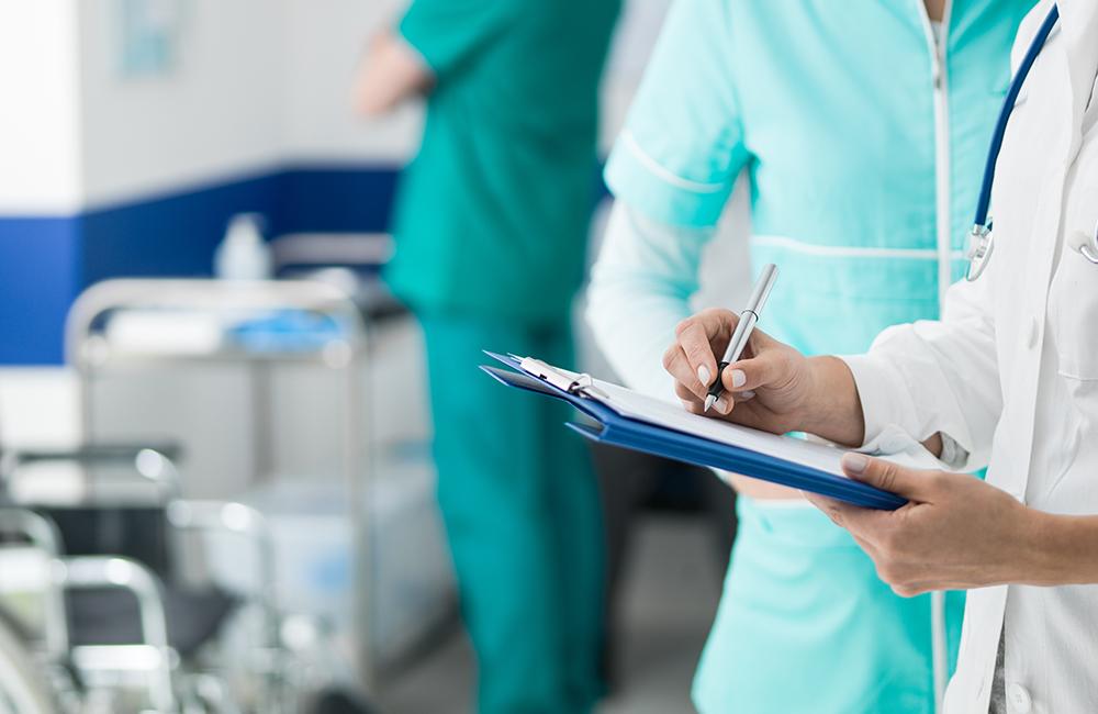 Doctor holding medical records (Envato Elements)