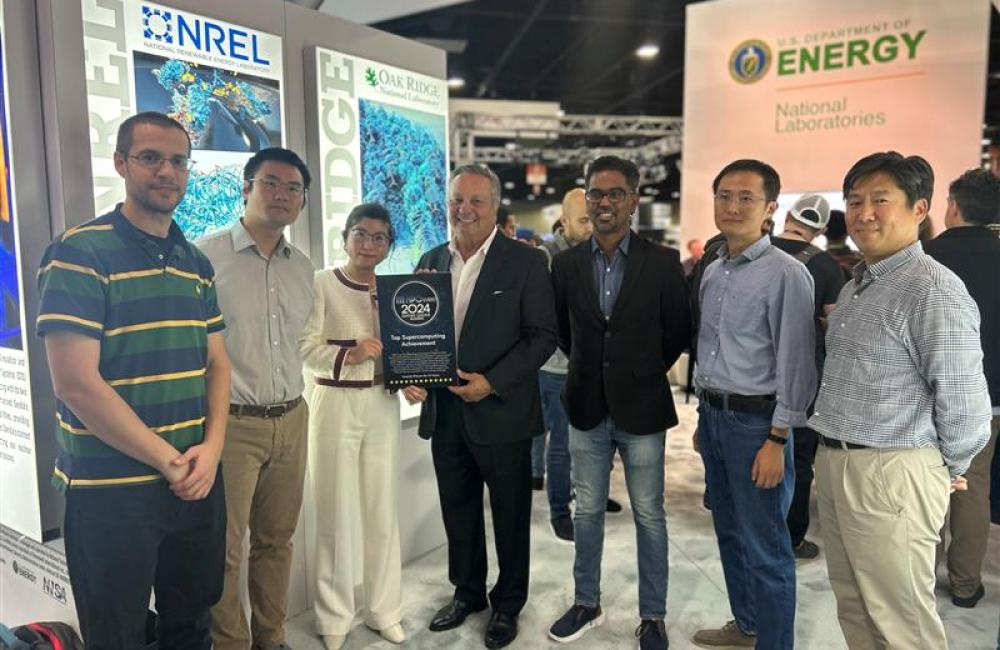 7 people from ORBIT research team accept their award from Tom Tabor (middle)