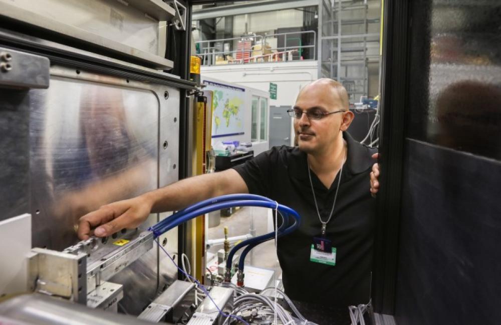 Kushol Gupta adjusts Bio SANS instrument at the High Flux Isotope Reactor. 