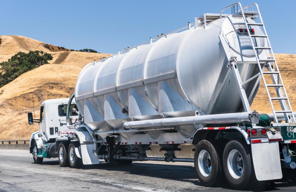 Tanker truck driving on the freeway through the hills of Alameda County, East San Francisco Bay Area, California. Image by Envato