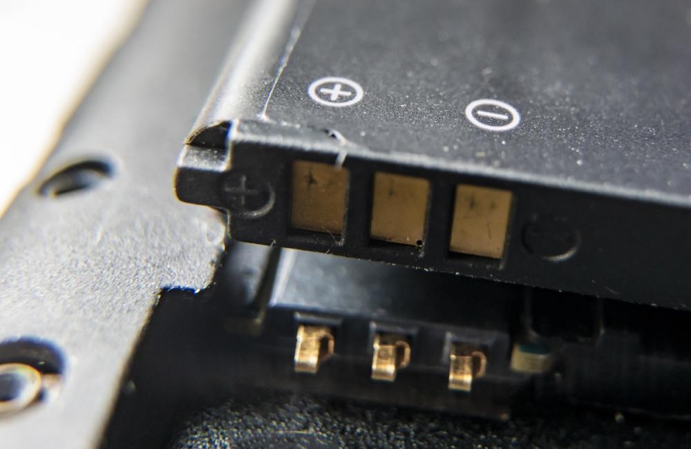 Golden electric contacts of circuit board or battery. Image from Envato