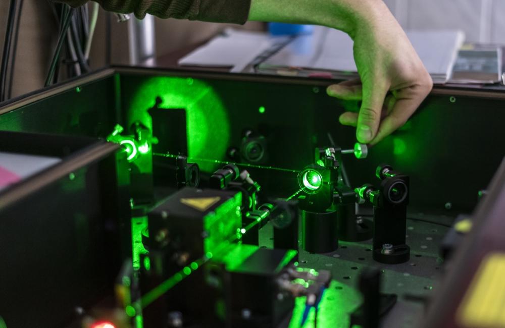 Scientist work with laser machine or system. Image from Envato