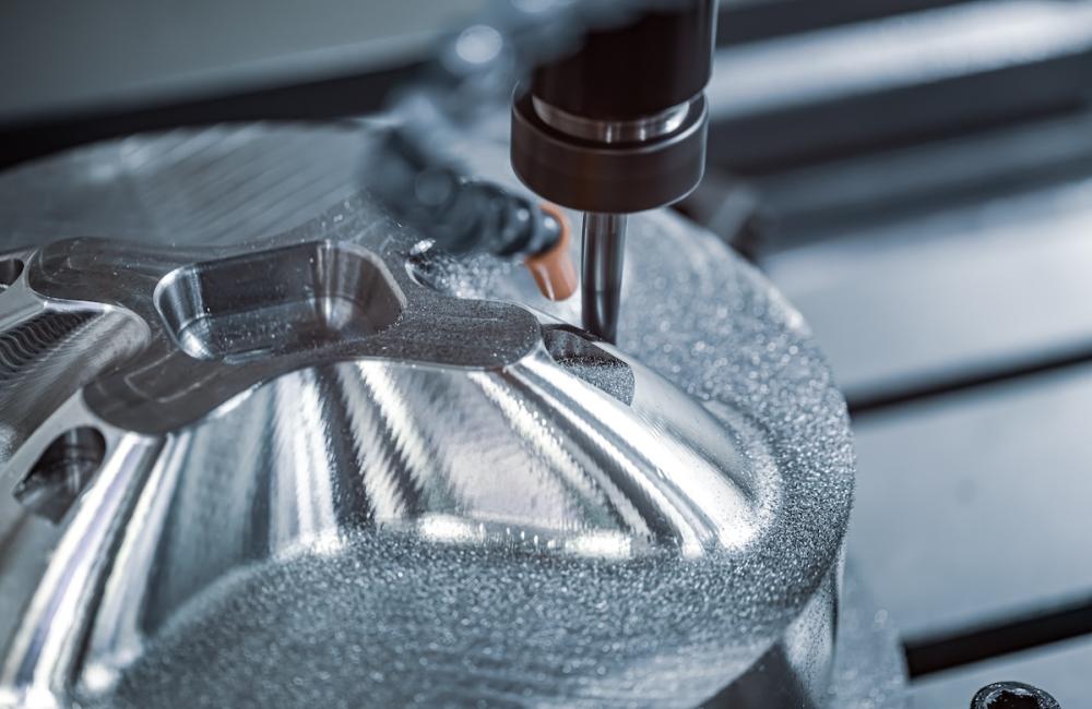 Metalworking CNC lathe milling machine. Cutting metal modern processing technology. Image from Envato