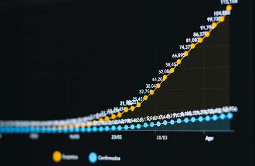 Black screen with yellow and blue lines of data running across.