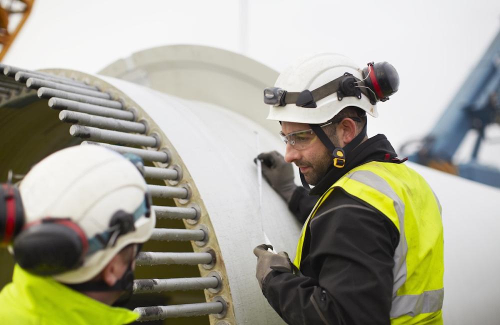 Engineers working on wind turbine. Image from Envato