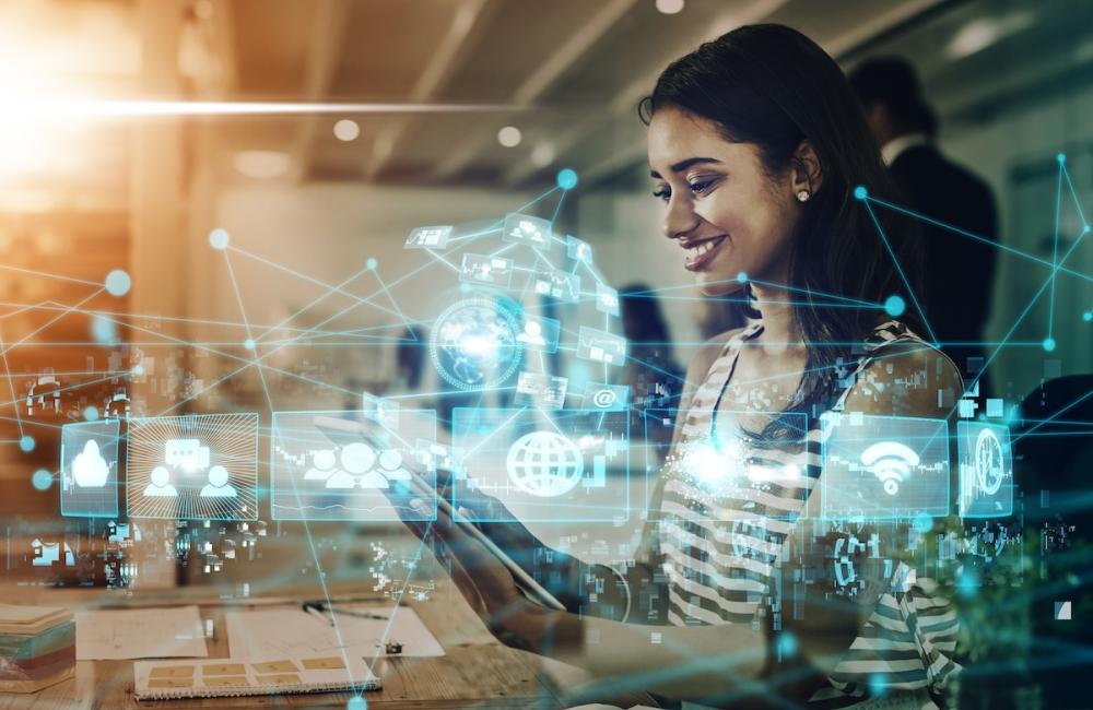 Internet, networking and digital transformation icons superimposed over woman and tablet. Image from Envato.