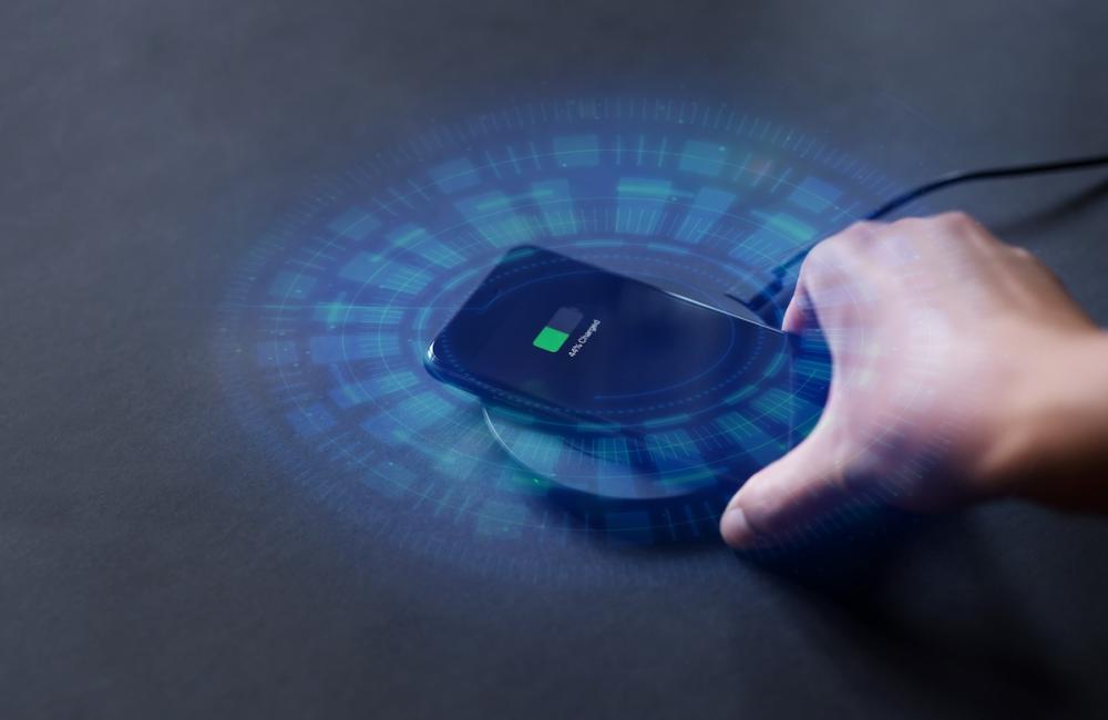 Image of cellphone charging wirelessly. Image from Envato