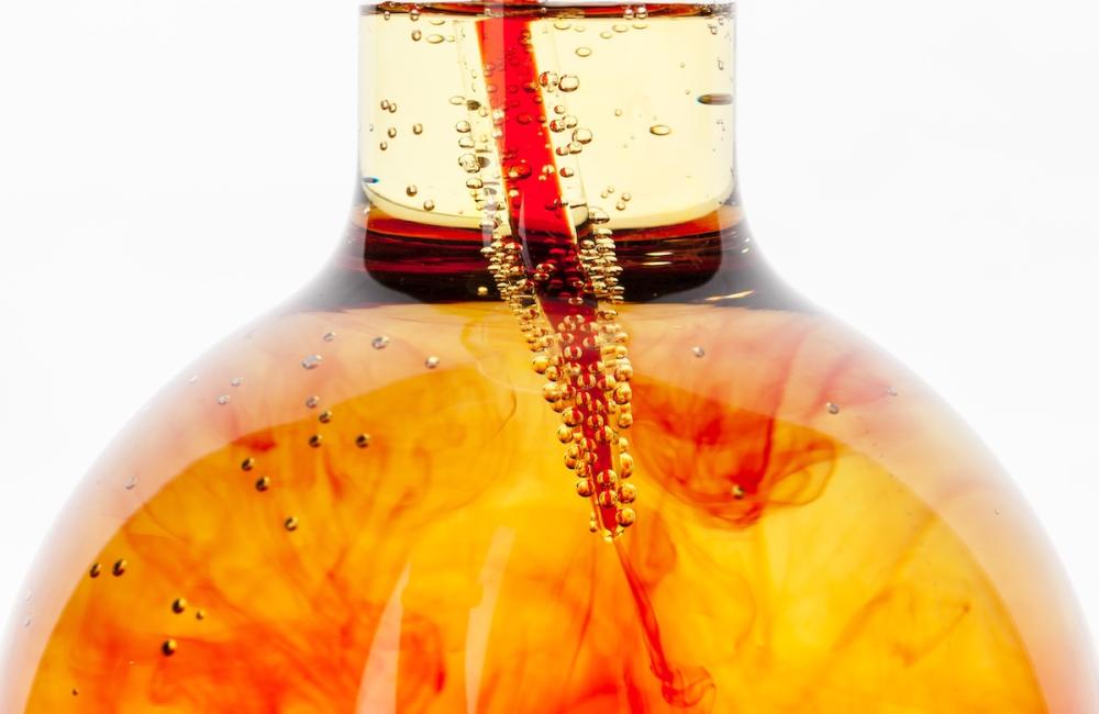 Laboratory flask glassware with reflections on table close up. Image from Envato