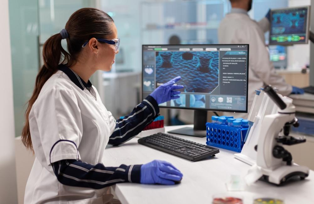 Chemical scientist conducting clinical virus research using computer. Image from Envato