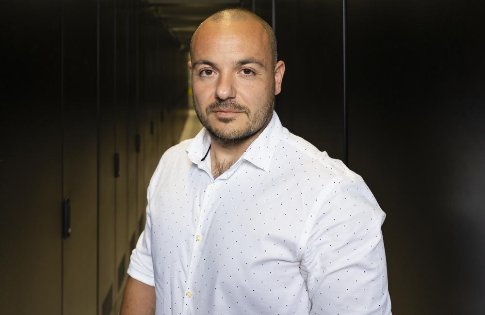 Max Pasini casual portrait in between server cabinets