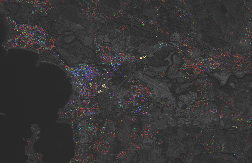 Satellite image with colorful dots overlayed indicated population dynamics and data