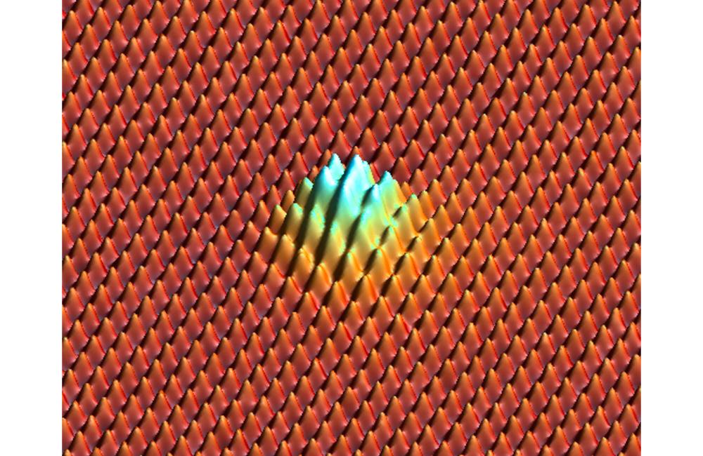 Neon atoms between graphene sheets poke the top sheet from below and stretch the crystalline lattice, forming a bubble at a pressure larger than that of the ocean at its greatest depth.