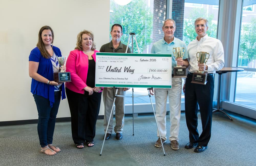 Oak Ridge National Laboratory’s United Way campaign's $900,000 “big check” with, from left, Ann Weaver, Sharon Kohler, Ken Tobin, Jimmy Stone, and David Keim. ORNL photo by Genevieve Martin
