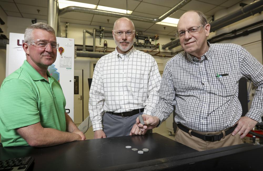 From left, ORNL’s Rick Lowden, Chris Bryan and Jim Kiggans were troubled that target discs of a material needed to produce Mo-99 using an accelerator could deform after irradiation and get stuck in their holder.