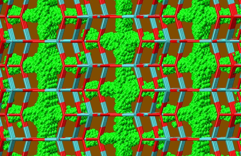 Researchers predicted where lithium ions (green spheres) would pack and move in an open framework of epitaxially strained vanadium dioxide, depicted here by a stick model (oxygen-connecting bonds are red and vanadium-connecting bonds, turquoise). 