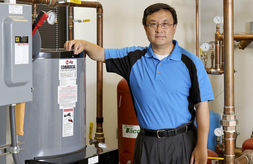ORNL researcher Xiaobing Liu  works in the laboratory’s Building Technologies Research and Integration Center.