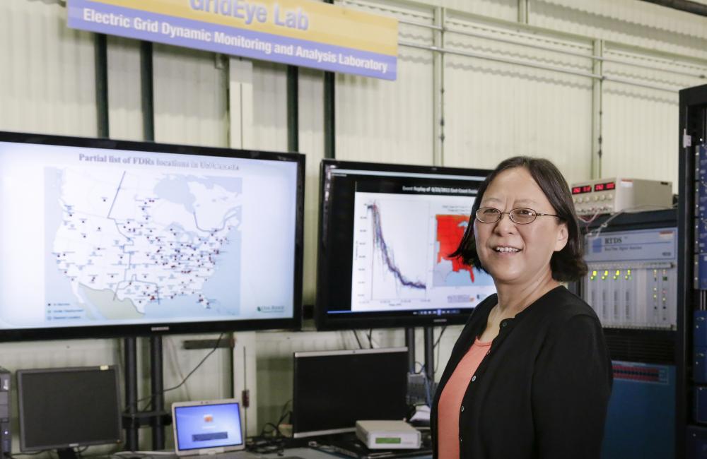 Yilu Liu with the FNET GridEye system in the lab.