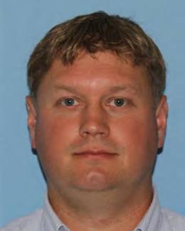 Badge photo of a man with blond hair