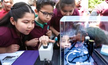 Young kids participating in a science demo