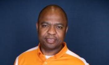 Portrait of a man in an orange shirt