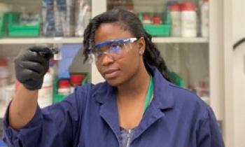 Ngozi Akingbesote in lab inspecting film