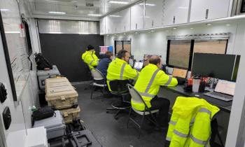Pilots sit in their mobile command center