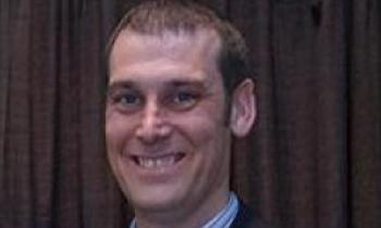 Photo of Justin Jacobs smiling.