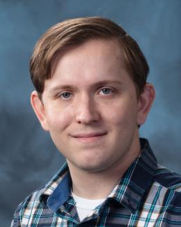 A studio portrait image of Nick Schmitt