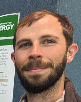 Dr. Hine at a SULI poster session in spring 2023