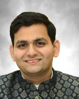 A picture of Akash Tiwari smiling for the camera.