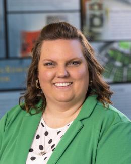 Headshot photo with BTRIC facility as background