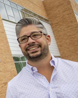 Trelewicz pictured in front of the Innovation and Discovery Center at Stony Brook University