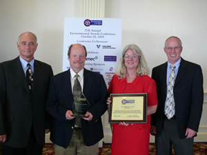 Presenting the award at Thursday's ceremony in Nashville was Richard Holland (left), chair, Tennessee Chamber of Commerce & Industry Environment Committee. Also pictured are, from left, Joe Herndon, director of Oak Ridge National Laboratory's Environment, Safety, Health, and Quality Directorate, and Susan Michaud and Jim Eaton of the ESH&Q Directorate.
