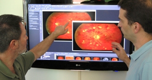 Oak Ridge National Laboratory researchers Ken Tobin (left) and Tom Karnowski see TRIAD as something that could be a life-changer for people at risk of diabetic retinopathy and other potentially blinding diseases. (Photo by Ron Walli/ORNL)
