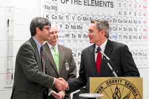 Great Schools Partnership President Buzz Thomas (right) shakes hands with ORNL Director Thom Mason (left) and Knox County Superintendent of Schools Jim McIntyre following the announcement of UT-Battelle's $450,000 gift to establish distance learning programs at area high schools.