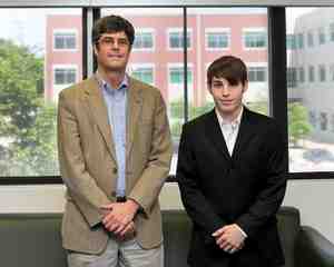 ORNL Director Thom Mason congratulates Oak Ridge High School senior Chris Ludtka on  receiving the UT-Battelle Scholarship.