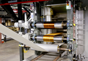 The Department of Energy's Carbon Fiber Technology Facility operated by Oak Ridge National Laboratory is accepting proposals from companies that want to test low-cost carbon fibers manufactured at the pilot scale plant. Pictured here are textile-grade acrylic fibers entering the first of four oxidation ovens, where they gradually turn from white to yellow, auburn, brown, then black. Once fully oxidized, the fiber is ready to run through the higher-temperature furnaces, which convert the oxidized fiber to carbon fiber.