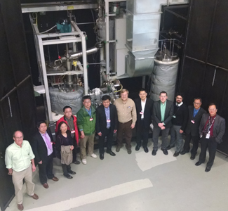 Representatives from Oak Ridge National Laboratory and the Shanghai Institute of Applied Physics (SINAP) met at ORNL to discuss plans for building a salt-cooled test reactor. Pictured in front of ORNL's molten salt test loop are (from left) David Felde, ORNL; Yang Zou, SINAP; Guanyuan Wu, SINAP; Xiaohan Yu, SINAP; Naxiu Wan, SINAP; Zhimin Dai, SINAP; David Holcomb, ORNL; Kun Chen, SINAP; Kevin Robb, ORNL; Mike Laufer, University of California at Berkeley; Guimin Liu, SINAP; Weiju Ren, ORNL.