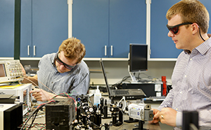 Oak Ridge National Laboratory researchers Raphael Pooser (left) and Benjamin Lawrie have used quantum correlated beams of light to reach unprecedented levels of detection from microcantilever-based sensors.