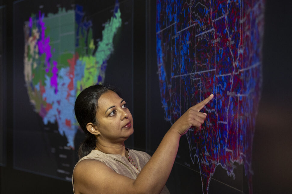 researcher pointing to a graph