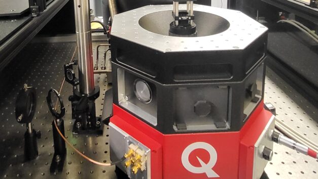 A stout red and black hexagonal piece of equipment