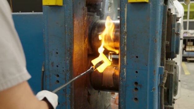 fire is shown between two tall blue columns